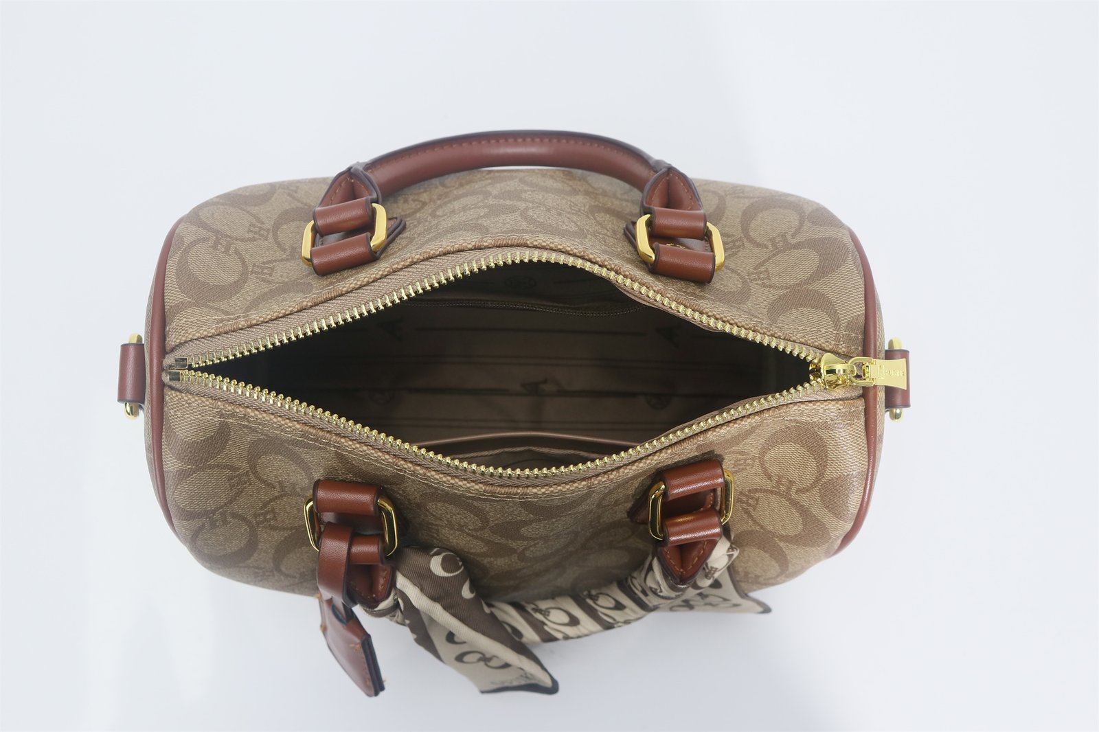 Customized Monogram printed women's handbag with scarf details and convertible shoulder straps
